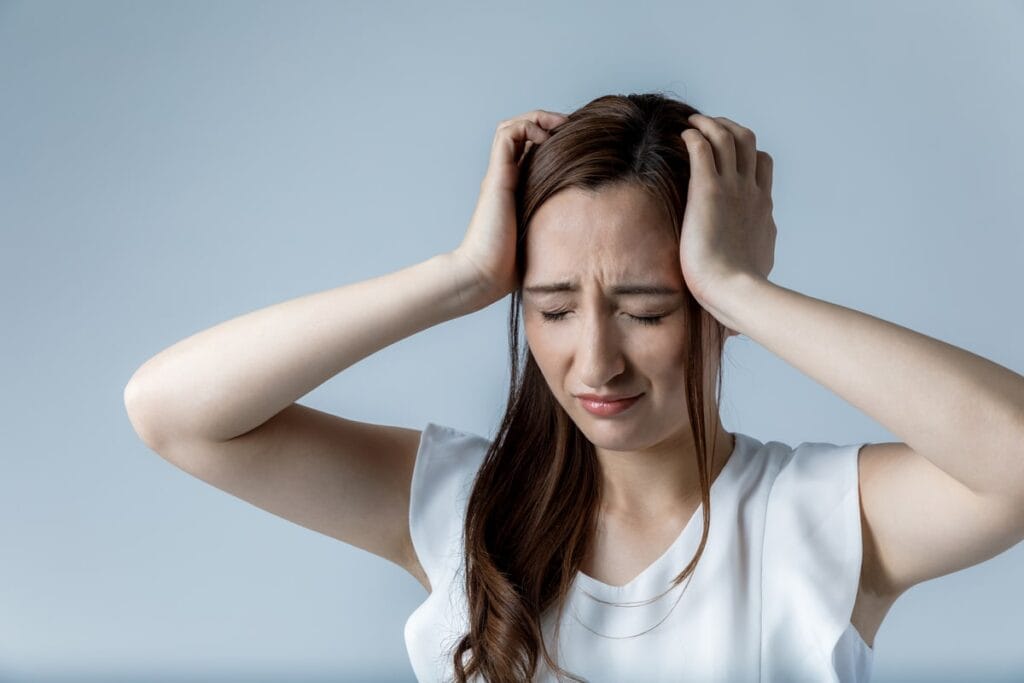 Woman suffering the effects of iron deficiency.