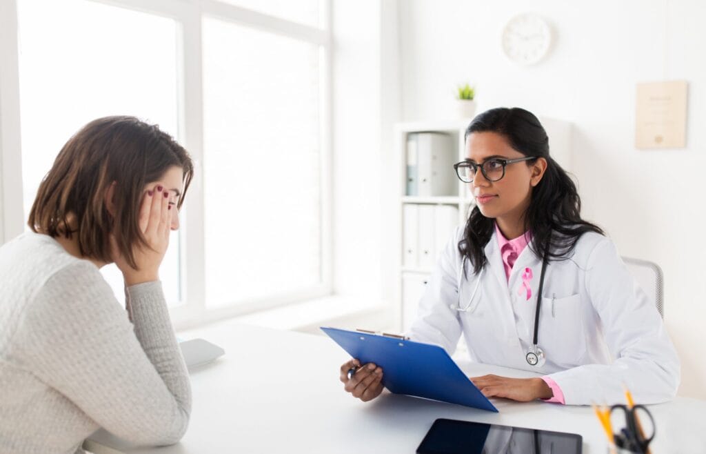 Doctor consulting woman about breast cancer