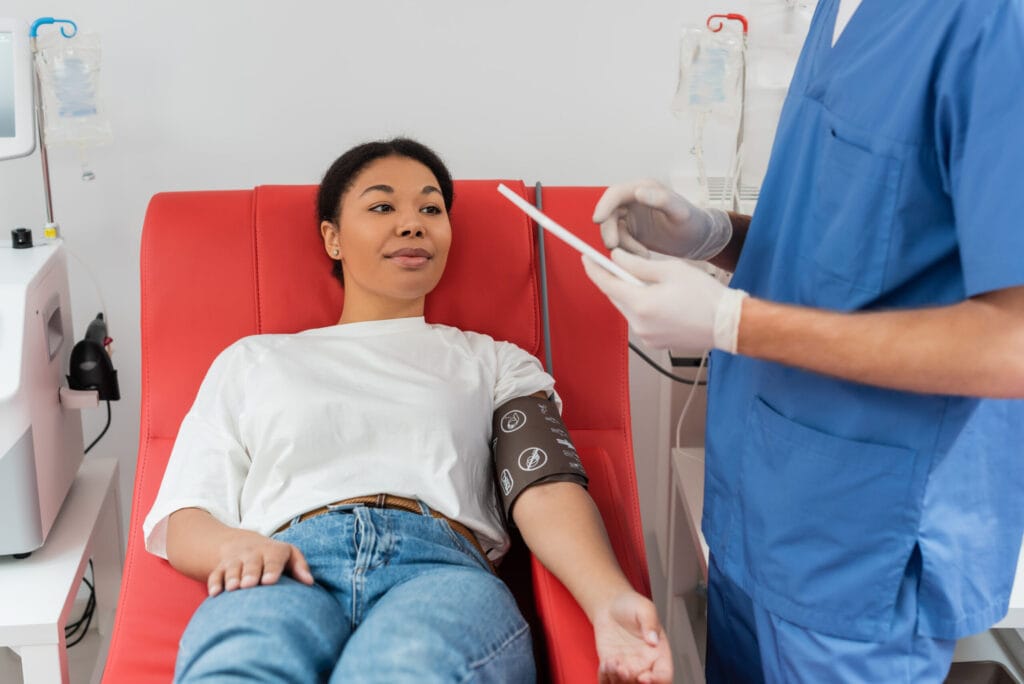Woman donating blood in medical clinic